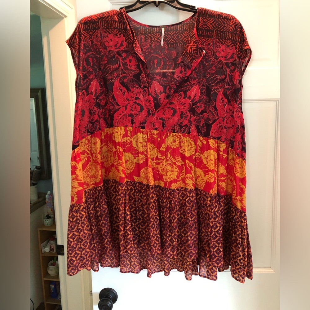Lightweight sleeveless tiered blouse.